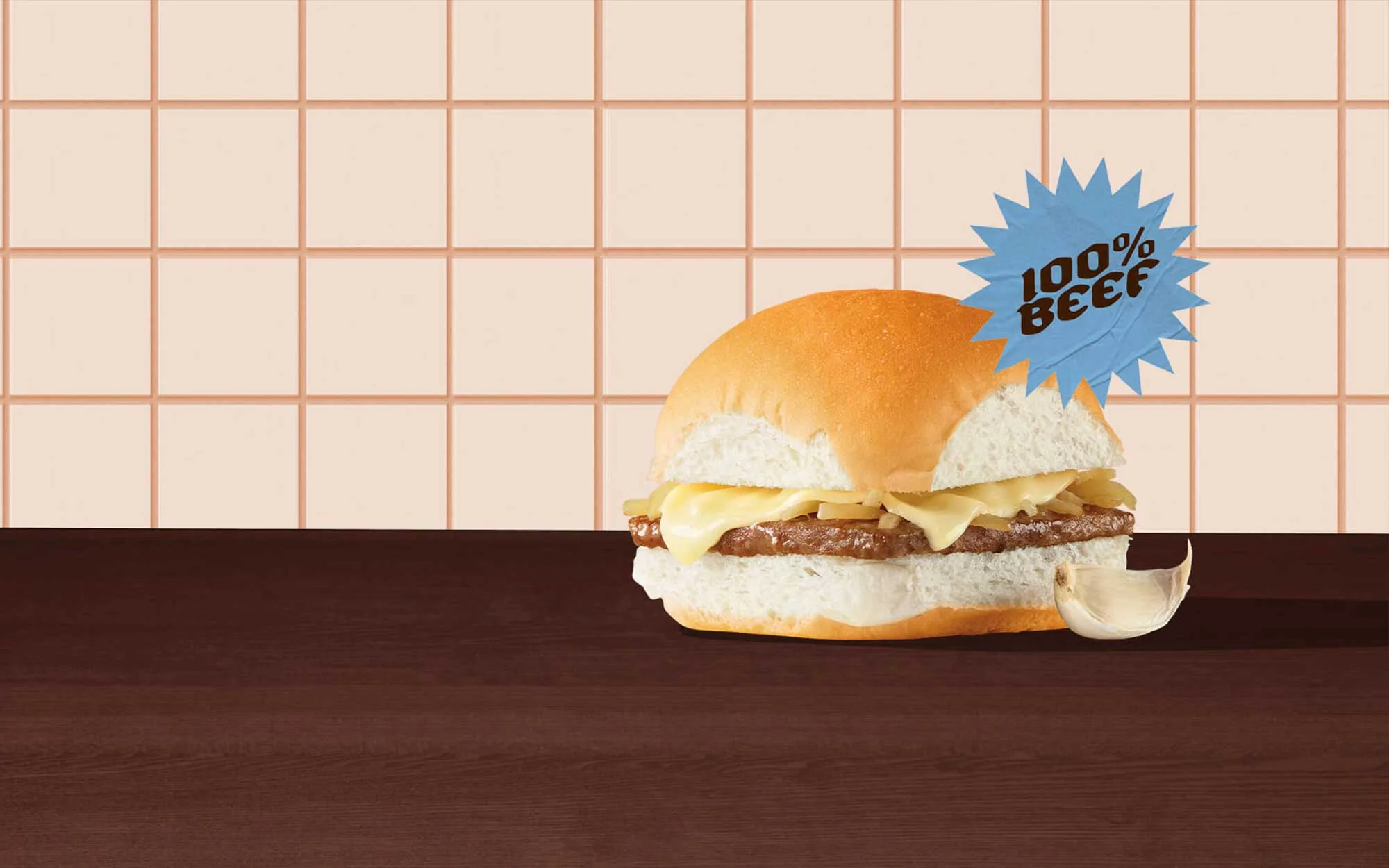 A garlic cheese slider against a cream tile backdrop